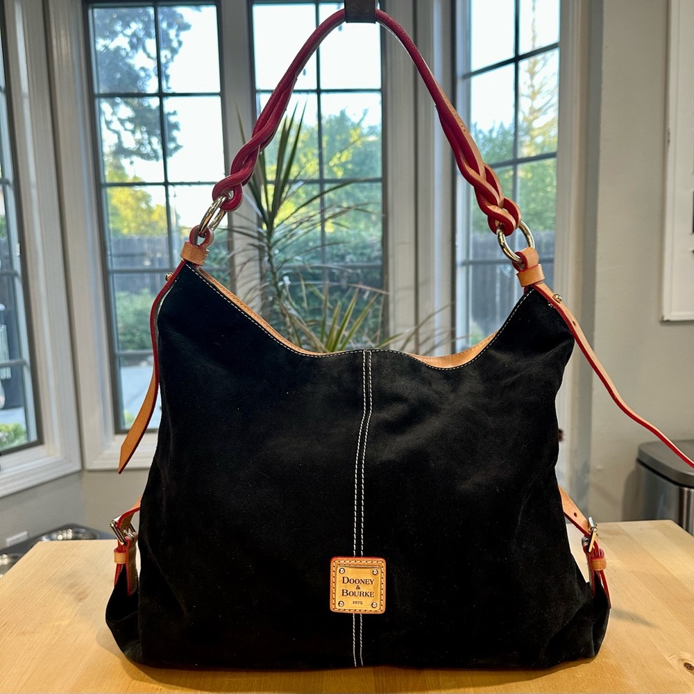 Dooney & Bourke Black Suede Hobo Bag with red braided strap.
